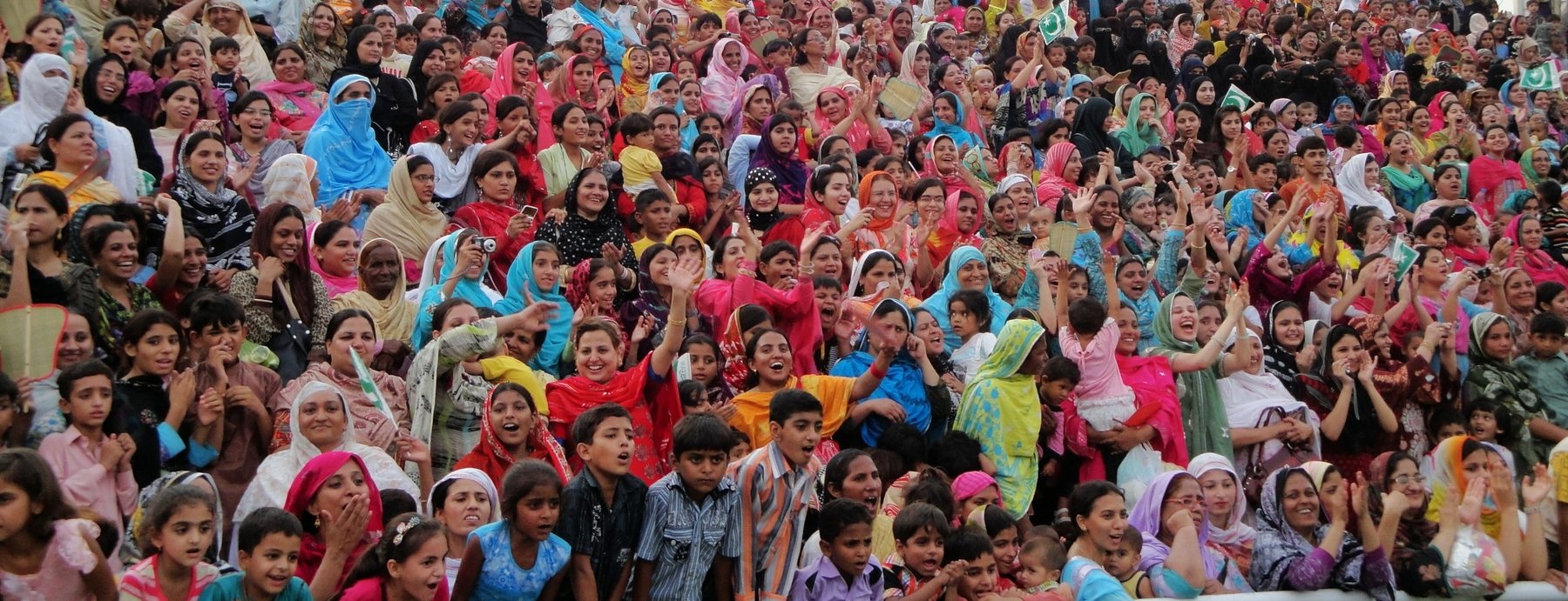 A colourful crowd at a local festival, Pakistan